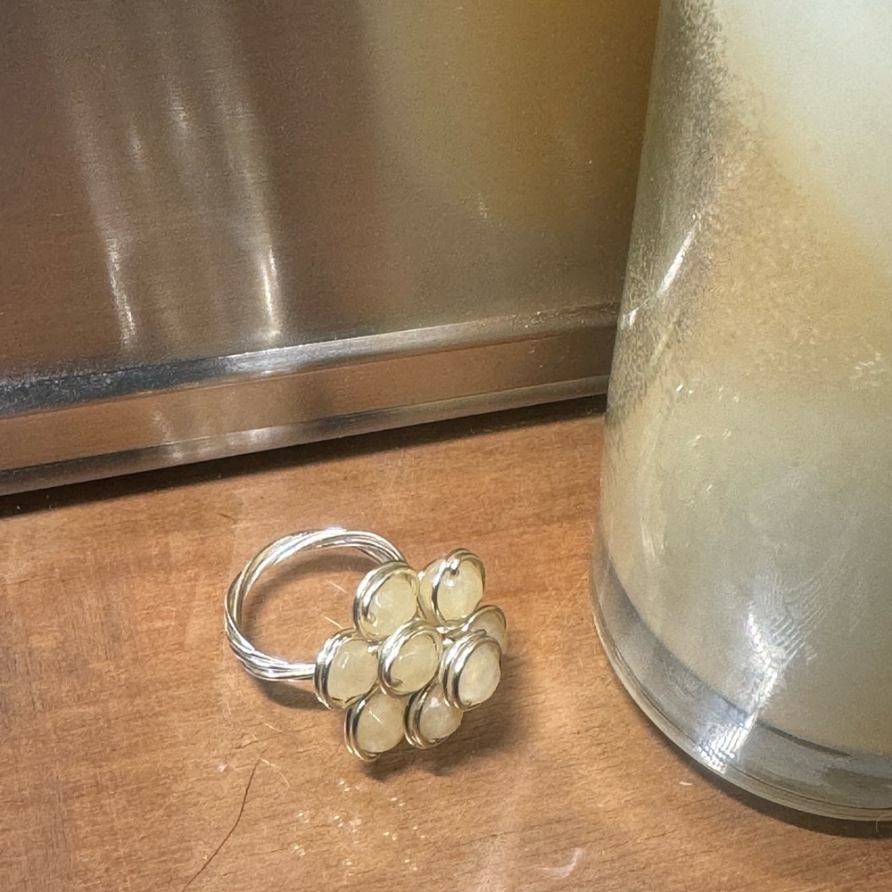 Sterling silver wire wrapped, crystal cut beads, weaved into an elegant ring.